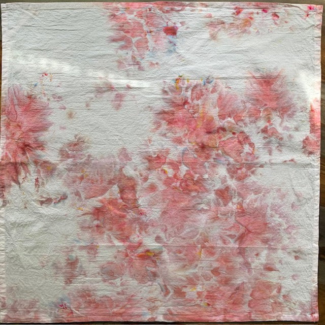 Marbled pink tea towel displayed flat